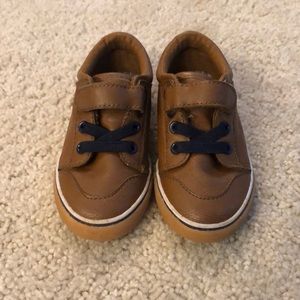 Brown leather with navy blue accent boys shoes.